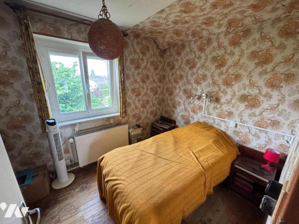 Maison 4 pièces (environ 84 m² habitables) située dans un secteur calme, proche centre