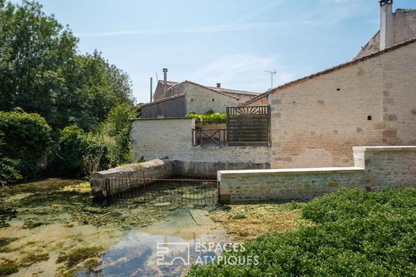 Maison en pierre chargée d’histoire dans un cadre bucolique