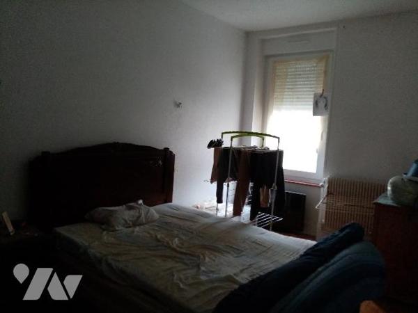 maison de rapport comprenant 3 appartements , un jardin et un garage