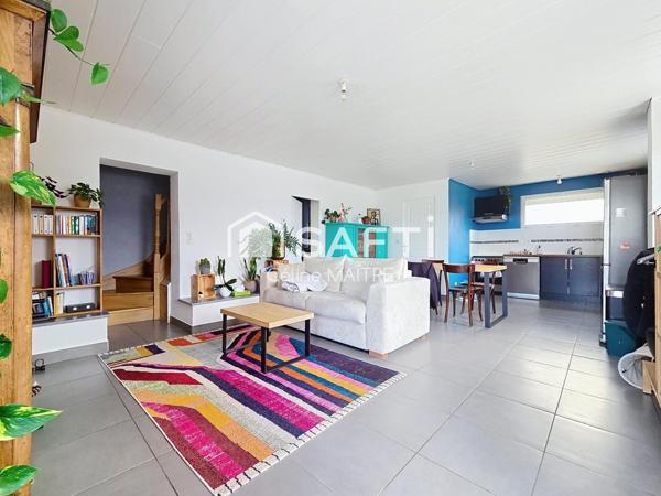 Maison mitoyenne avec grand jardin