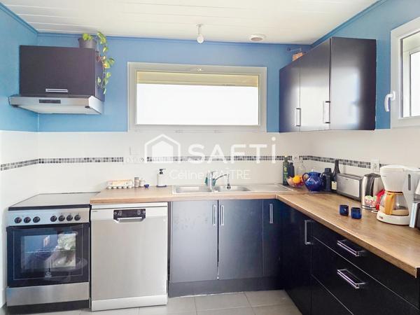 Maison mitoyenne avec grand jardin