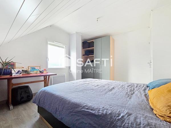 Maison mitoyenne avec grand jardin