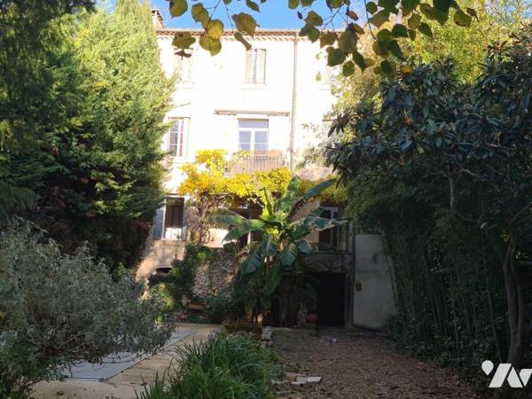 IMMEUBLE DE RAPPORT COMPOSÉ D'UN BUREAU, ET 4 LOGEMENTS 