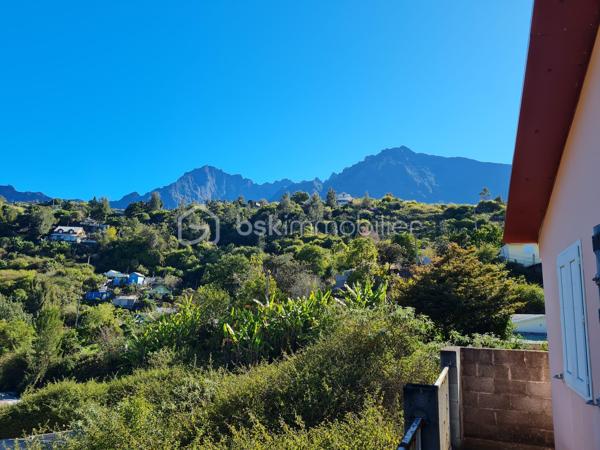 Offrez vous une vue imprenable sur les remparts de CILAOS !!!
Je vous propose  en exclusivité a la vente cette jolie maison dans un quartier calme et a proximité de toutes les commodités.
Épicerie a 100 m, école primaire , et arrêt de bus , 5 minutes du centre de CILAOS en voiture.
Bâtie sur une parcelle de 403 m 2 la maison se compose d'un salon/salle a manger de 29 m2 env d'une cuisine de 13 m2 env de 2 cambres de plus de 10 m2et d'une grande salle de bain de 6.50 m2 ,  1 WC séparé 
Le tout est distribué par un couloir traversant .
Une climatisation réversible récemment installée ainsi qu'un chauffe eau solaire sont la pour votre confort. 
Vous profiterez en plus d'une grande varangue de 25 m2 couverte et fermée sur 2 cotés avec son coin typique feu de bois et une vue magnifique pour recevoir famille et amis.
La maison est vendue entièrement meublée et équipée.
Vous pourrez donc soit vous y installer rapidement ou la mettre en location pour la rentabiliser. !!!
NE LAISSEZ PAS PASSEZ CETTE BELLE AFFAIRE ,CONTACTEZ MOI SANS TARDER !