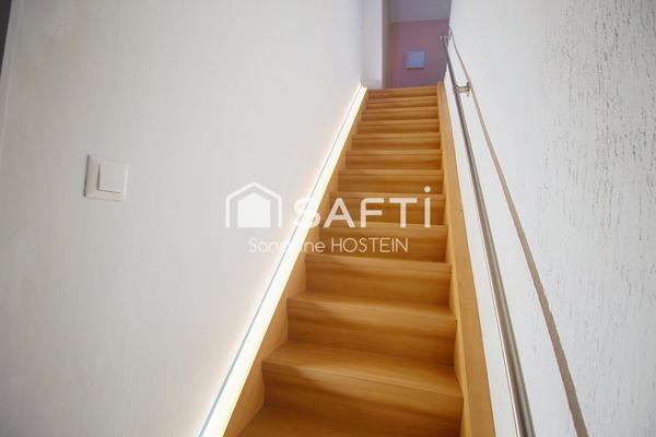 Appartement Duplex avec 3 chambres-mezzanine-caves-garage et jardin!