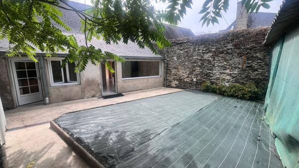 Maison de plain-pied avec jardin