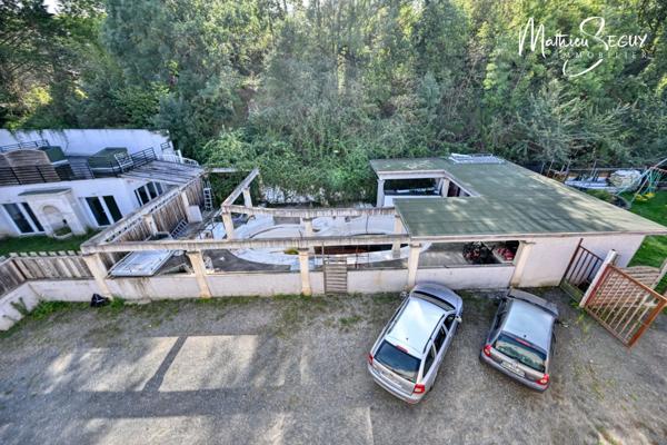 Ensemble Immobilier à St Genis Laval en zone activité, vendu libre d'occupation