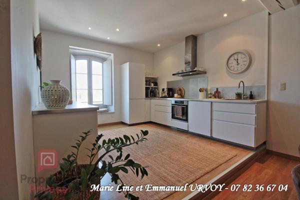 Appartement T3 bis de 109 m² dans bel immeuble avec ascenseur et place de parking sécurisée