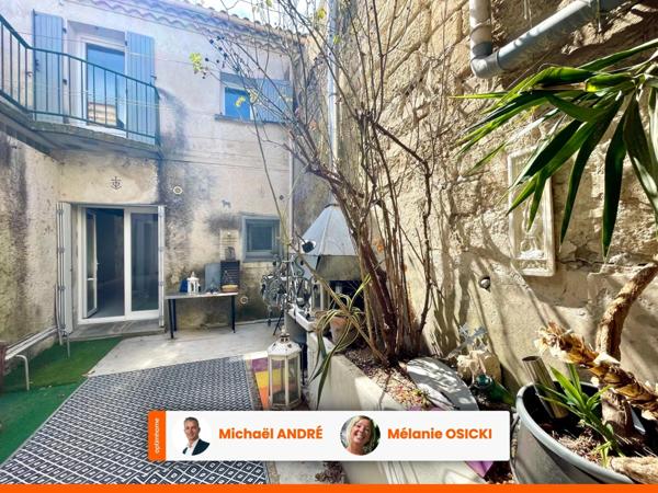 MAISON DE VILLAGE TRAVERSANTE AVEC PATIO ET GRAND GARAGE