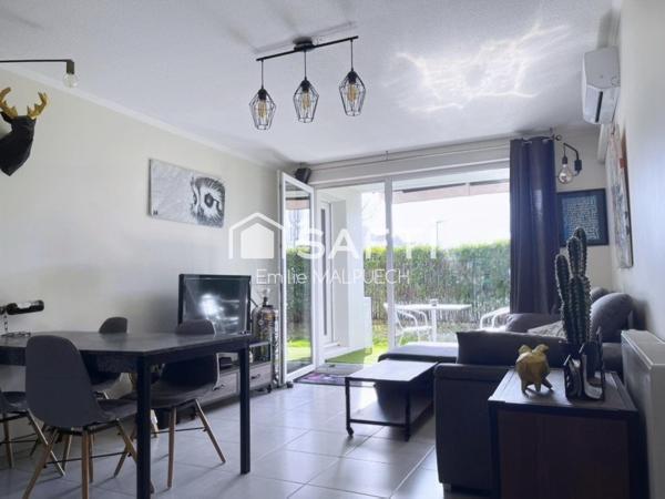 T3 traversant avec jardin et parking à Saint Alban