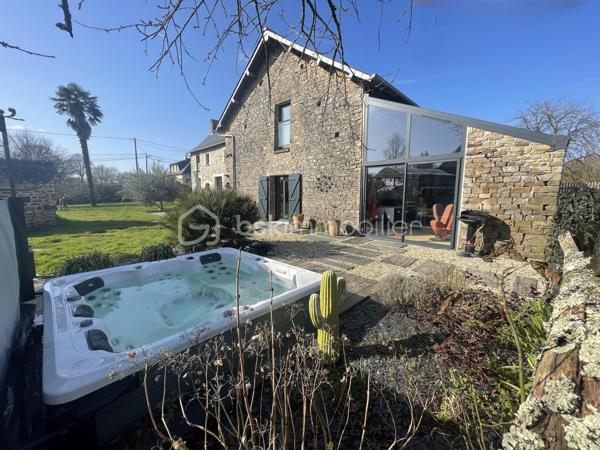 À proximité de Rennes, sur la commune de Guichen, venez découvrir en exclusivité cette demeure d’exception du 18ème siècle, entièrement rénovée, alliant charme authentique, matériaux de qualité et une performance énergétique digne d’une maison contemporaine !
Au cœur d’une parcelle de 5500 m2 entièrement clôturée, cette magnifique bâtisse en pierres d’une surface de 335m2 a été rénovée dans les règles de l’art par des professionnels.

Au rez de chaussée, un hall d’entrée tout en volume, avec rangements intégrés vous permettra d’accéder à un vaste salon-séjour très lumineux, puis à une cuisine remarquable chaleureuse et fonctionnelle et enfin à une suite parentale avec salle d’eau dont l’exposition Est vous permettra d’admirer chaque matin le lever de soleil par la véranda qui la termine.
De nombreux rangements, une cave, une buanderie, des toilettes complètent ce niveau.

Au 1er étage, vous accéderez à un vaste salon de détente avec bibliothèque, écran de cinéma amovible, 3 chambres spacieuses à la décoration raffinée, et avec pour chacune, une salle d’eau ou une salle de bain. Un bureau aux rangements multiples ainsi que 2 WC complètent ce niveau.

L’espace extérieur a été aménagé avec soin et respect de l’environnement : terrasse, pergola, spa, four à pain fonctionnel et cuisine d’été dans la véranda. Un élégant carport vous permettra d’abriter 2 véhicules.

Rare pour ce type de bien : des coûts de fonctionnement réduits !
Le chauffage est assuré par un système aérothermie avec planchers chauffants. Panneaux solaires et batteries associées permettent une réduction et un stockage de l’énergie électrique.
Une cuve de récupération d’eau de pluie de 5m3 enterrée alimente les WC et permet l’arrosage.

Les atouts de ce bien :
- bien rare à la prestance exceptionnelle
- rénovation complète haut de gamme
- performance énergétique B
- exposition optimale Est / Ouest
- situation stratégique avec Gare SNCF à quelques minutes à pied

VIDEO DE PRESENTATION EXTERIEURE DISPONIBLE SUR DEMANDE