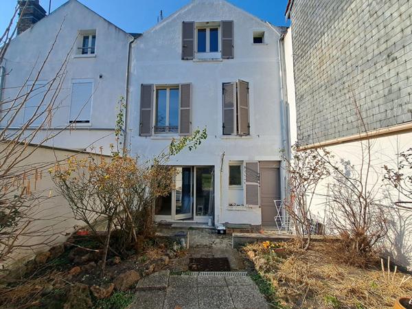 Maison de 148m² avec un petit jardin en centre ville de Mantes La Jolie