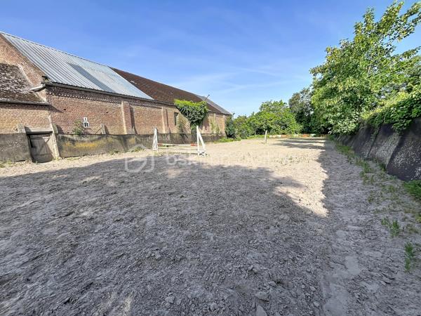 A 20 mins de Saint Quentin, dans une commune avec toutes les commodités nécessaires, cet ensemble immobilier est idéal pour les passionnés de chevaux ou personne ayant un projet agricole, touristique  ou dans l'événementiel ...

Composé d'une maison d'habitation , pleine de charme avec ses matériaux anciens ( parquets en chevrons, cheminées en marbre ...) et de nombreuses dépendances ( écuries, atelier, greniers ...) , l'ensemble est actuellement exploité en centre équestre.

La maison de 280 m2 offre de beaux volumes : accessible par deux entrées différentes, vous découvrirez au rez de chaussée une spacieuse pièce de vie de 45 m2, un ou deux bureaux selon vos besoins, une cuisine aménagée, une lingerie , une véranda avec vue sur toute la cour et des toilettes.

A l'étage, un vaste palier dessert quatre chambres et une salle d'eau rénovée ainsi que des toilettes indépendants ; vous disposerez de deux autres pièces supplémentaires ( bureau ou lingerie ...)

Un grenier de + 100 m2 pourra être entièrement aménagé.

L'extérieur dispose des infra structures  suivantes :

- une carrière de 75 X 25 m
- un manège de 30 X 13
- un paddock
- plusieurs dépendances avec au total 25 boxs
- des écuries 
- un club house 
- un atelier
- une sellerie

Les greniers des dépendances servent de lieux de stockage et peuvent être exploités.

UN BIEN RARE DE PAR SON POTENTIEL ! Que vous soyez un particulier en quête d'un projet de vie ou un investisseur à la recherche d'une belle opportunité, cette propriété n'attend plus que votre imagination .... 

CONTACTEZ MOI POUR UNE VISITE