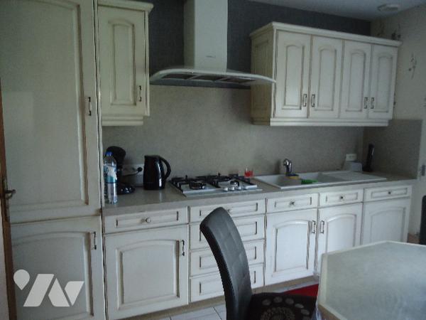 Plain pied individuel en briques, proche du centre ville.
