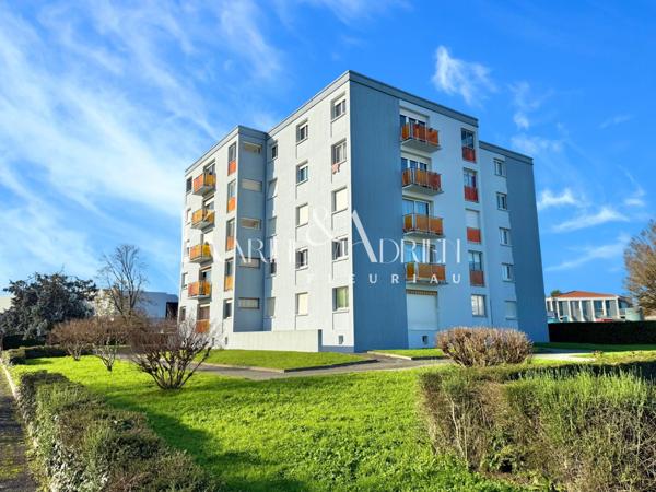 Appartement 2 chambres, balcon, cave privative et garage privatif