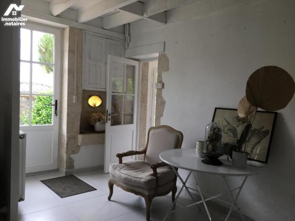 IEDEAL MAISON DE VACANCES OU PREMIER INVESTISSEMENT POUR CETTE AGRÉABLE MAISON EN PIERRE AVEC JARDIN