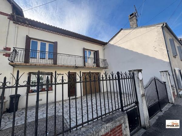 Maison de ville avec garage et jardin