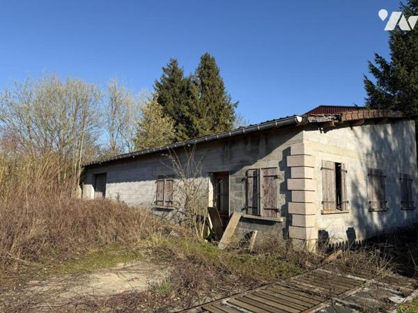 MIRAUMONT - Terrain à bâtir supportant un batiment