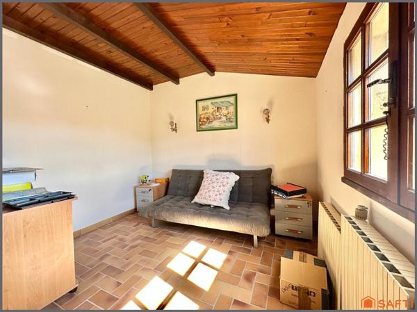 Maison familiale avec garage et grand terrain clôturé