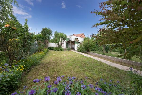 Maison de 90m² avec 3 chambres, garage, et jardin