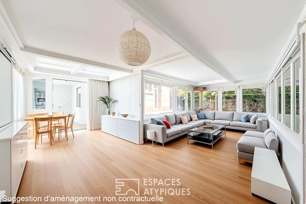 Rez-de jardin avec terrasses et véranda, rue de la Colonie