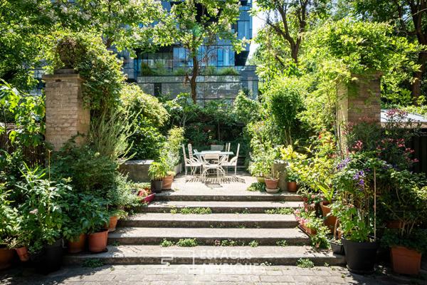 Rez-de jardin avec terrasses et véranda, rue de la Colonie