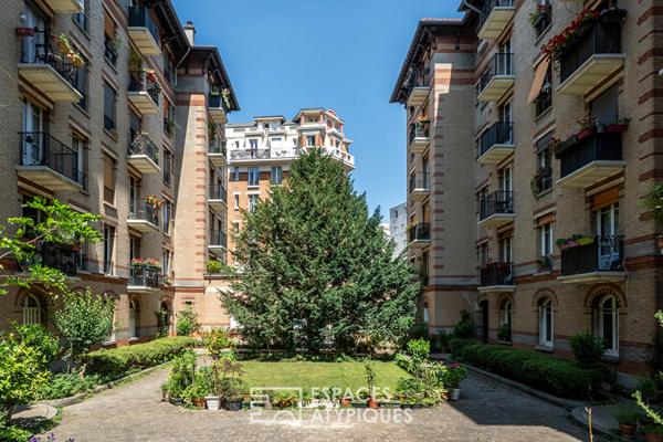 Rez-de jardin avec terrasses et véranda, rue de la Colonie