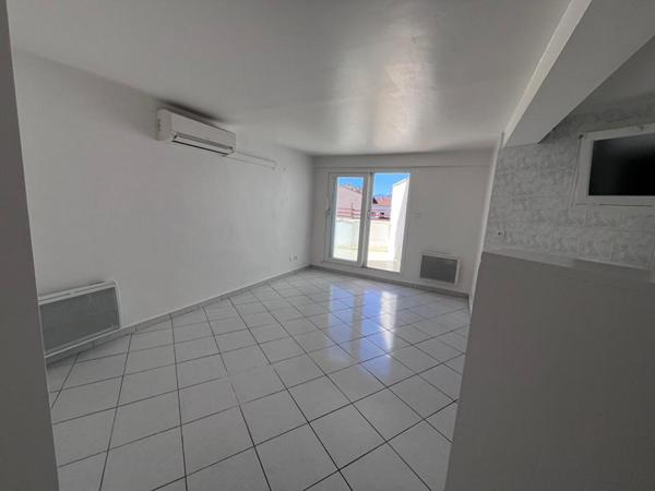 Charmant appartement de type loft au dernier étage d'une résidence de standing avec petite terrasse