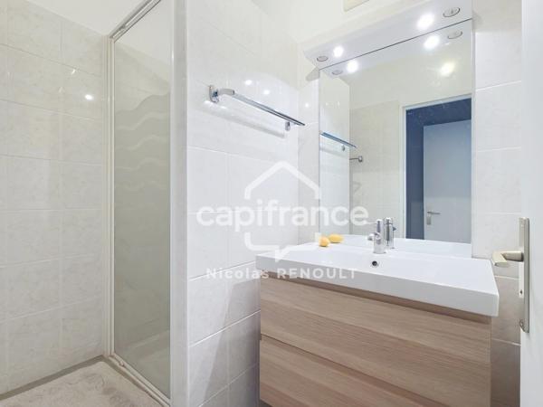Appartement spacieux avec cave & parking