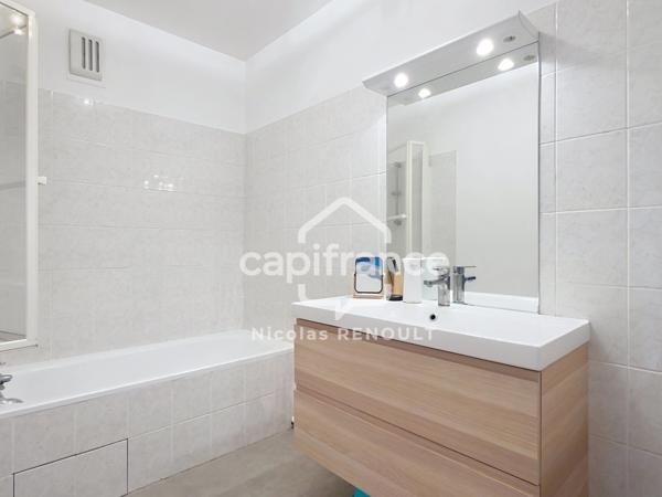 Appartement spacieux avec cave & parking