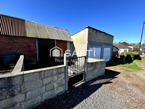 Garage avec cave, remise et terrasse