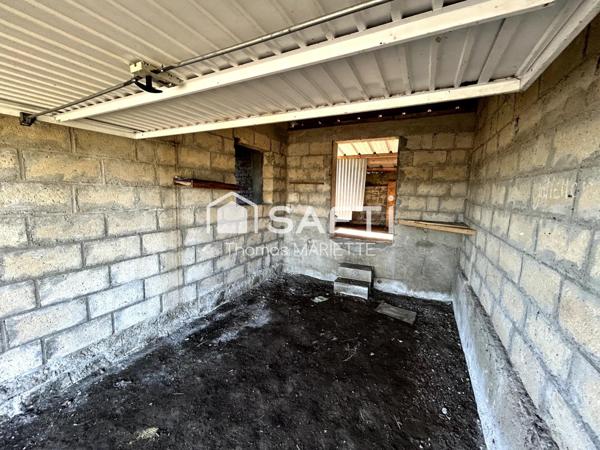 Garage avec cave, remise et terrasse