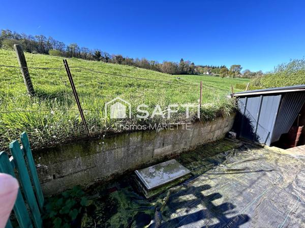 Garage avec cave, remise et terrasse