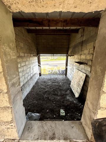 Garage avec cave, remise et terrasse