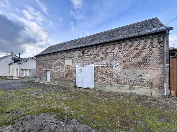 CORPS DE FERME AVEC HANGARS  ET PATURE

Amoureux de la nature, d'espace et de grands projets, cet ensemble immobilier est idéal  :  ce corps de ferme a un très gros potentiel, idéalement pour une activité équestre, artisanale ou projet familial en pleine nature ...

A proximité immédiate de l'autoroute A26, cette propriété dispose d'une maison principale de plain pied , de nombreuses dépendances, de deux  hangars, petite écurie et pâture, le tout sur presque 7000 m2 !

LA MAISON D'HABITATION  offre de beaux volumes  avec une pièce de vie de plus de 60 m2 avec insert bois, propice aux moments de convivialité,  , trois belles chambres de minimum 15 m2 chacune , une cuisine aménagée, une véranda exposée plein SUD permettant de profiter de la vue sur la cour, une salle de bain mixte, deux autres pièces pouvant faire office de bureau, chambre ou cellier, ainsi qu'une lingerie.

L'étage de 200 m2 est entièrement aménageable et permettrait ainsi de doubler la surface habitable, soit plus de 400 m2 au final !

L'EXTERIEUR : entièrement clos, avec une grande cour centrale, et accessible par trois entrées différentes (dont la principale avec portail motorisé ),  vous offre de multiples perspectives.
Vous y trouverez  : 

double garage avec portes manuelles, 
atelier,
ancienne étable ( environ 60 m2),
un hangar de 400 m2 avec petit espace mezzanine,
ancienne salle de traite,
cave extérieure,
un verger,
un hangar avec un box cheval et petit paddock et accès direct sur une PATURE de 2300 m2

Menuiseries bois double vitrage, chauffage au fuel, insert bois de 2019, assainissement individuel, rafraichissement à prévoir ...

Cet ensemble  s’adresse aussi bien aux passionnés d’équitation, qu’aux porteurs de projets nécessitant de grands volumes de stockage ou d’activité.

CONTACTEZ MOI POUR UNE VISITE