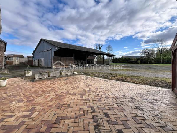 CORPS DE FERME AVEC HANGARS  ET PATURE

Amoureux de la nature, d'espace et de grands projets, cet ensemble immobilier est idéal  :  ce corps de ferme a un très gros potentiel, idéalement pour une activité équestre, artisanale ou projet familial en pleine nature ...

A proximité immédiate de l'autoroute A26, cette propriété dispose d'une maison principale de plain pied , de nombreuses dépendances, de deux  hangars, petite écurie et pâture, le tout sur presque 7000 m2 !

LA MAISON D'HABITATION  offre de beaux volumes  avec une pièce de vie de plus de 60 m2 avec insert bois, propice aux moments de convivialité,  , trois belles chambres de minimum 15 m2 chacune , une cuisine aménagée, une véranda exposée plein SUD permettant de profiter de la vue sur la cour, une salle de bain mixte, deux autres pièces pouvant faire office de bureau, chambre ou cellier, ainsi qu'une lingerie.

L'étage de 200 m2 est entièrement aménageable et permettrait ainsi de doubler la surface habitable, soit plus de 400 m2 au final !

L'EXTERIEUR : entièrement clos, avec une grande cour centrale, et accessible par trois entrées différentes (dont la principale avec portail motorisé ),  vous offre de multiples perspectives.
Vous y trouverez  : 

double garage avec portes manuelles, 
atelier,
ancienne étable ( environ 60 m2),
un hangar de 400 m2 avec petit espace mezzanine,
ancienne salle de traite,
cave extérieure,
un verger,
un hangar avec un box cheval et petit paddock et accès direct sur une PATURE de 2300 m2

Menuiseries bois double vitrage, chauffage au fuel, insert bois de 2019, assainissement individuel, rafraichissement à prévoir ...

Cet ensemble  s’adresse aussi bien aux passionnés d’équitation, qu’aux porteurs de projets nécessitant de grands volumes de stockage ou d’activité.

CONTACTEZ MOI POUR UNE VISITE