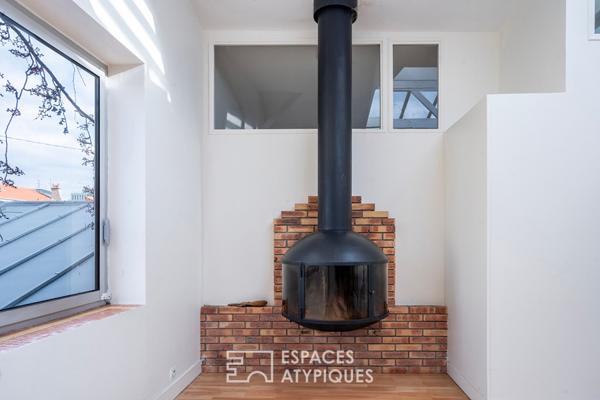 Duplex lumineux sous verrière à la lisière de Paris