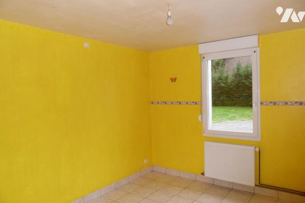 Maison individuelle avec garage et terrain