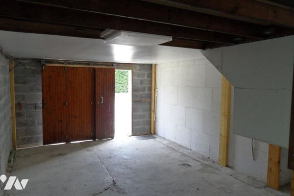 Maison individuelle avec garage et terrain