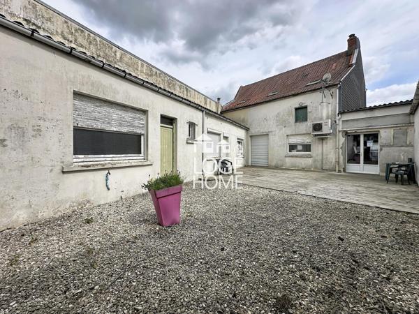 Immeuble a usage mixte avec fort potentiel de rentabilite garage + exterieurs