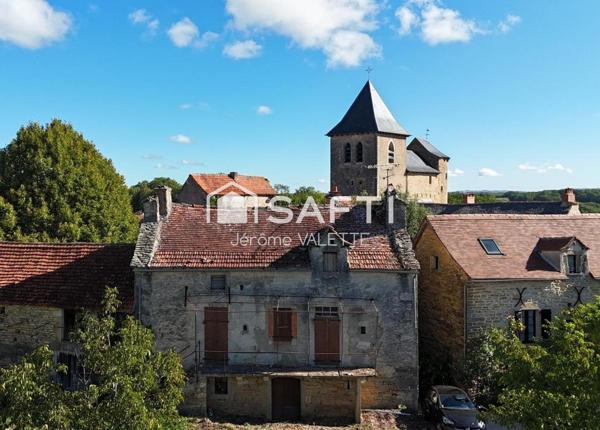 Charmante maison en pierre de 55m² avec grange attenante de 48m² et cave de 50m² offrant un beau potentiel d'aménagement