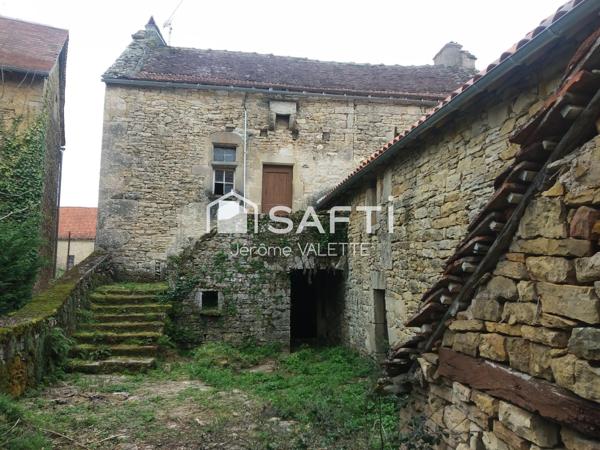 Charmante maison en pierre de 55m² avec grange attenante de 48m² et cave de 50m² offrant un beau potentiel d'aménagement