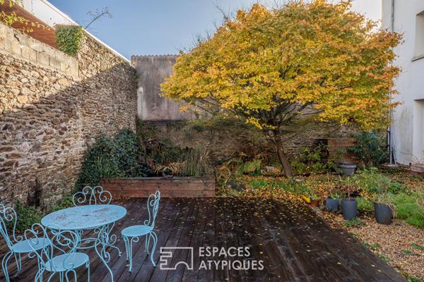 Esprit maison de ville : duplex atypique avec jardin partagé