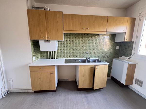T3 avec balcon, cave et parking