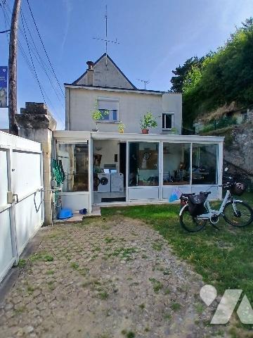 Maison d'habitation avec garage et jardin proche centre