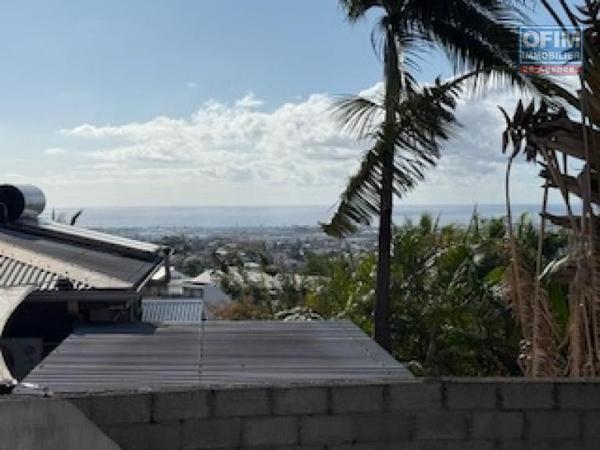 À vendre à La Possession Appartement F3/F4 en rez-de- jardin avec vue mer