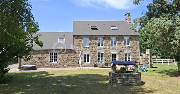 Propriété équestre de caractère – Maison en pierre de 208 m² avec installations complètes sur un terrain clos de 10 414 m²
Amoureux des chevaux et de la nature, découvrez cette magnifique propriété alliant charme, espace et fonctionnalité.

Cette authentique maison en pierre d'environ 190 m² offre de beaux volumes, une belle luminosité et un agencement idéal pour une vie de famille.
Au rez-de-chaussée, vous découvrirez une superbe pièce de vie de 65 m², baignée de lumière, comprenant une cuisine aménagée et équipée ouverte sur la salle à manger et le salon. Cet espace chaleureux est agrémenté d'un poêle à bois, suite parentale de 20 m², buanderie de 20 m² ainsi qu'un WC indépendant complètent ce niveau.
Au premier étage, un vaste dégagement dessert trois belles chambres, dont une avec sa salle d'eau privative, une spacieuse salle de bains de 10 m² équipée d'une baignoire et d'une douche, un WC indépendant, grenier aménageable.
Au deuxième étage, sous les combles, deux belles chambres viennent compléter l'ensemble.

À l'extérieur, les passionnés d'équitation seront séduits par des installations équestres de qualité comprenant :
- un manège couvert d'environ 420 m² 
- 6 boxes/sellerie avec mezzanine 
- une carrière d'environ 2 500 m² 
- deux dépendances offrant de nombreuses possibilités de stockage ou d'aménagement.

L'ensemble est implanté sur un magnifique terrain clos et paysagé de 10 414 m², soigneusement entretenu. 

Les atouts
Maison en pierre de caractère d'environ 208 m2
6 chambres
Pièce de vie de 65 m² avec cuisine ouverte et poêle à bois.
Suite parentale au rez-de-chaussée
Maison économe en énergie avec un classement en C au DPE
Installations équestres  
Etat irréprochable 
Cadre de vie privilégié 
A proximité : chemins de bocage qui mènent vers la Butte de Grosmont et la vallée de la Vire (réseau de chemins creux, de pistes agricoles et de passages boisés). 

Situation géographique : 
- 4 minutes d'un bourg toutes commodités (écoles/commerces/pôle santé/pharmacie) - LA GRAVERIE 14350, 
- 6 km de VIRE 14500 (gare SNCF - PARIS/GRANVILLE), 10 de l'autoroute (A84 - CAEN/RENNES), 30 de ST LO 50000,
- 45 minutes de CAEN, 55 de GRANVILLE, 
- PARIS à 280 km

Une propriété rare, idéale pour une famille, des cavaliers ou le développement d'une activité équestre, alliant le charme de l'ancien à des équipements de qualité dans un cadre de vie privilégié.
Un bien d'exception à découvrir sans tarder !
