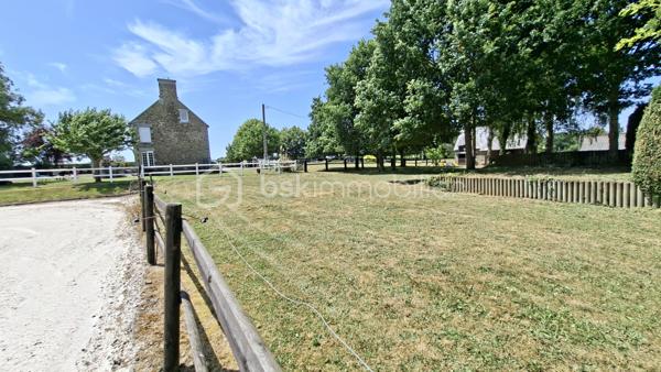 Propriété équestre de caractère – Maison en pierre de 208 m² avec installations complètes sur un terrain clos de 10 414 m²
Amoureux des chevaux et de la nature, découvrez cette magnifique propriété alliant charme, espace et fonctionnalité.

Cette authentique maison en pierre d'environ 190 m² offre de beaux volumes, une belle luminosité et un agencement idéal pour une vie de famille.
Au rez-de-chaussée, vous découvrirez une superbe pièce de vie de 65 m², baignée de lumière, comprenant une cuisine aménagée et équipée ouverte sur la salle à manger et le salon. Cet espace chaleureux est agrémenté d'un poêle à bois, suite parentale de 20 m², buanderie de 20 m² ainsi qu'un WC indépendant complètent ce niveau.
Au premier étage, un vaste dégagement dessert trois belles chambres, dont une avec sa salle d'eau privative, une spacieuse salle de bains de 10 m² équipée d'une baignoire et d'une douche, un WC indépendant, grenier aménageable.
Au deuxième étage, sous les combles, deux belles chambres viennent compléter l'ensemble.

À l'extérieur, les passionnés d'équitation seront séduits par des installations équestres de qualité comprenant :
- un manège couvert d'environ 420 m² 
- 6 boxes/sellerie avec mezzanine 
- une carrière d'environ 2 500 m² 
- deux dépendances offrant de nombreuses possibilités de stockage ou d'aménagement.

L'ensemble est implanté sur un magnifique terrain clos et paysagé de 10 414 m², soigneusement entretenu. 

Les atouts
Maison en pierre de caractère d'environ 208 m2
6 chambres
Pièce de vie de 65 m² avec cuisine ouverte et poêle à bois.
Suite parentale au rez-de-chaussée
Maison économe en énergie avec un classement en C au DPE
Installations équestres  
Etat irréprochable 
Cadre de vie privilégié 
A proximité : chemins de bocage qui mènent vers la Butte de Grosmont et la vallée de la Vire (réseau de chemins creux, de pistes agricoles et de passages boisés). 

Situation géographique : 
- 4 minutes d'un bourg toutes commodités (écoles/commerces/pôle santé/pharmacie) - LA GRAVERIE 14350, 
- 6 km de VIRE 14500 (gare SNCF - PARIS/GRANVILLE), 10 de l'autoroute (A84 - CAEN/RENNES), 30 de ST LO 50000,
- 45 minutes de CAEN, 55 de GRANVILLE, 
- PARIS à 280 km

Une propriété rare, idéale pour une famille, des cavaliers ou le développement d'une activité équestre, alliant le charme de l'ancien à des équipements de qualité dans un cadre de vie privilégié.
Un bien d'exception à découvrir sans tarder !