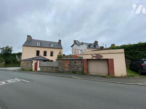 Une maison en pierre composée
Au rdc: une entrée desservant une véranda, un séjour salon, une ...