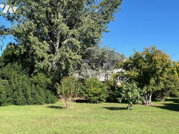 Au THOUREIL Maison avec vie de plain-pied dans parc paysager 